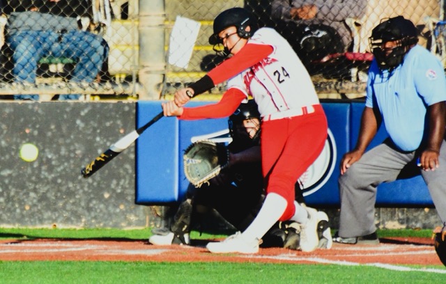 Corona Centennial’s Teuuaina Sanchez (24) laces a single to right field during the Huskies season-opening 7-3 win over South Hills.