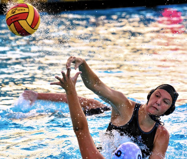 Corona Santiago’s Hayley Jane Pence (top) shoots and scores over Los Al’s Harper Wille (9) during CIF playoff action. The Sharks beat the Griffins 10 – 8.