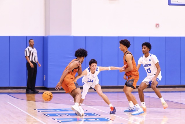 Coyotes #3 Tommy Smith uses the screen to fool his defender and explode from a behind the back move