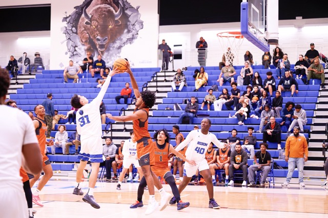 Coyotes #3 Tommy Smith blocks Bison #31