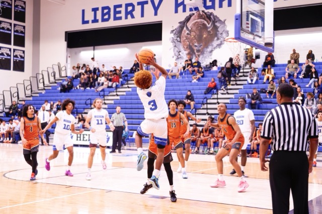 Bison’s #3 fades away on the baseline to make get a tough 2 points