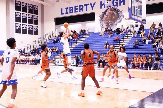 Liberty’s #21 rises up on a middy to get an uncontested bucket