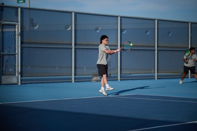 Agile play to backhand a ball on an extra high bounce