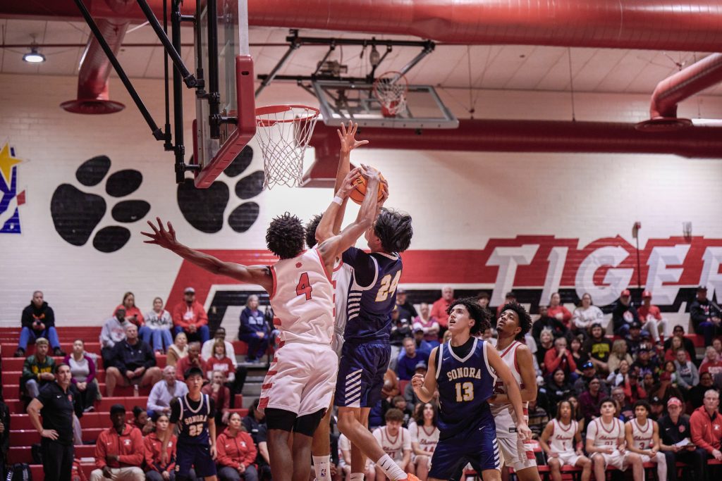 Elsinore plays the Hesperia Scorpions tonight. Tigers #4 Nasir Bates blocks Raiders #24 Jacob San Martin. Photo by Marcus Walker