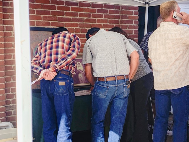 The book of family history that presenter Adrian Smith put together sat open for anyone to flip through.