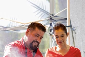 Adalberto and Delia Quiroz, owners of Quiroz Tacos, work the plancha at the Wanderlust Food Festival and Marketplace in Winchester last Saturday Credit: Lisa Zambrano
