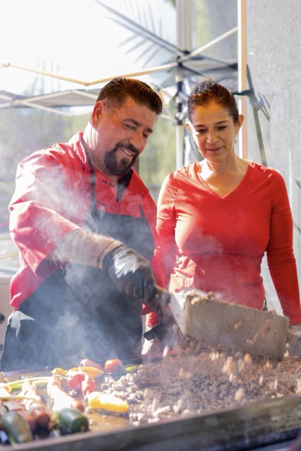 Adalberto and Delia Quiroz, owners of Quiroz Tacos, work the plancha at the Wanderlust Food Festival and Marketplace in Winchester last Saturday Credit: Lisa Zambrano