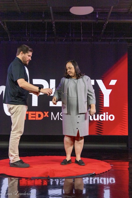 Menifee USD. Dr. Jennifer Root, Menifee Union School District Superintendent, is mic’d up by Alan Marsala, Associate Professor & Chair of the Creative Media Department at Mt. San Jacinto College, before she gives a TED talk about the importance of understanding the underlying reason for student truancy, at the MSJC Studio in Menifee.