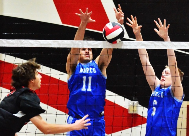 Corona Centennial’s Indy Ledford (left) and Norco’s Layne Maalona (11) and Nathan Roy (6) watch Leford’s volley roll over the net.