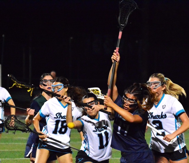 Santiago’s Brooke Beebe (18), Londyn Manuel (11), and Hannah Lovanti (2) battle Temecula Chaparral’s Lexa Li (17) during their match in Corona. The Pumas defeated the Sharks 6 – 4.