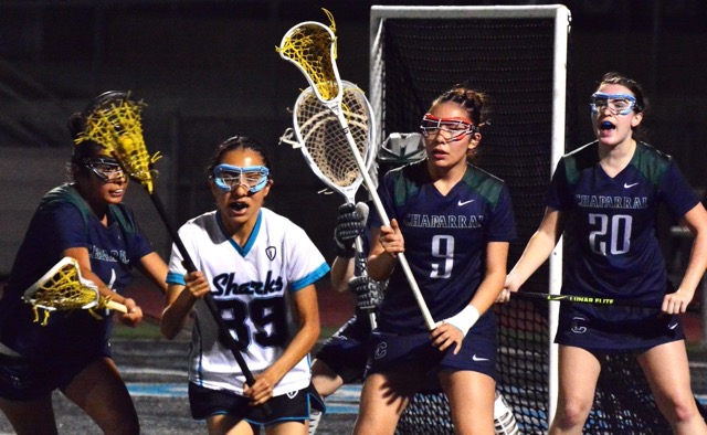 Corona Santiago’s Viri Vergara is surrounded by Temecula Chaparral’s Adamaris Antonio (4), Anaisa Moreno (9), and Madi Mosiello (20) during the Pumas 6 – 4 victory over the Sharks.