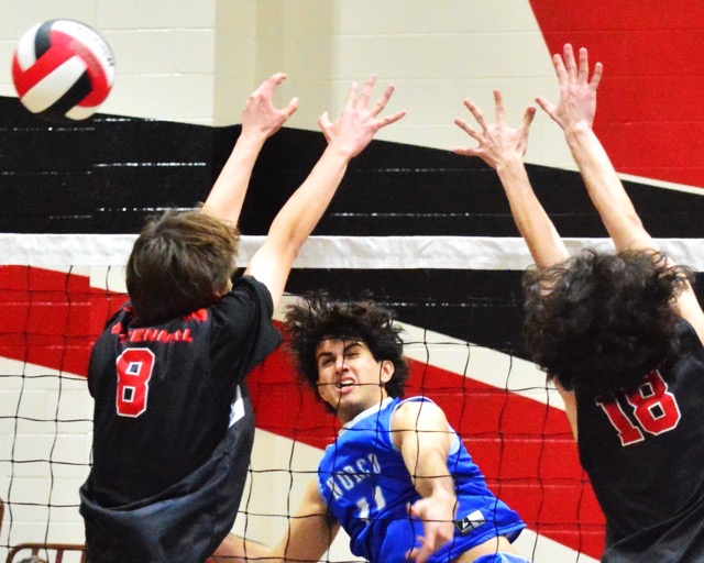 Corona Centennial’s Indy Ledford (8) and Daniel Navarro Jr. (18) try to block Norco’s Layne Maalona (11) shot during the Huskies 3 – 2 victory over the Cougars.
