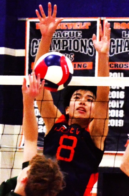 Eastvale Roosevelt’s Hayden Alfonso (8) eyes a block over the net during the Mustangs 3 – 0 victory over the Ontario Christian Knights.