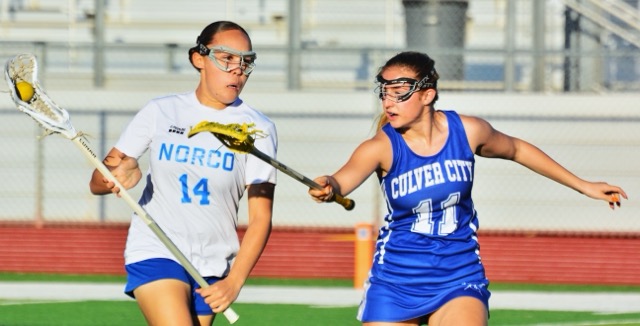 Norco’s Jamie Martinez (14) works her way around a Culver City player during the Centaurs 20 – 2 victory over the Cougars.