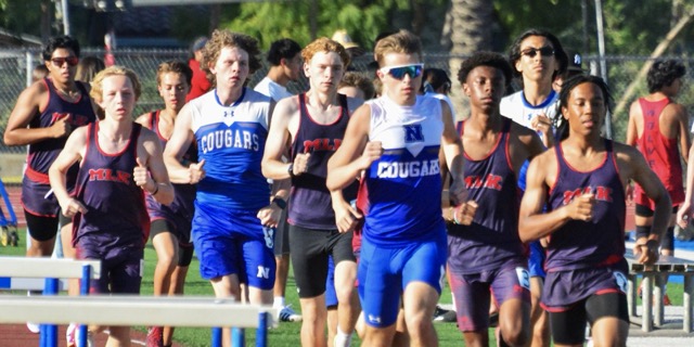 (L-R) Riverside King’s Nathan Harris, Hayden Maxwell, Grayson Pendleton, Norco’s Hudson Busch, King’s Luke Browning, Norco’s Daniel Silva Jr., King’s Andrew Moyo, Norco’s Izaak Rendon, and King’s Andrew Hearn compete in the varsity boys 1600 race. Hearn and Moyo finished with 4:59:46 and 4:59:95 times, respectively. Rendon (5:02:61), Silva Jr. (5:03:27), and Busch (5:13:07) followed.