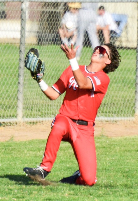 Centennial’s Jesse Mendoza races in from left field to make a sliding, juggling catch on a pop-up by Norco’s Zach Fielder. The Huskies jumped out to a 4 – 0 lead in the top of the second. Norco got two in the bottom of the second, tied the game in the fourth, and scored four more in the sixth to win 8 – 4.