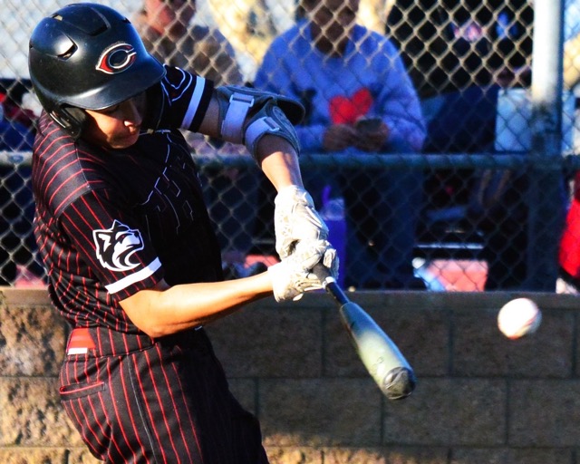 Centennial’s Christian De La O smacks a single to center field.