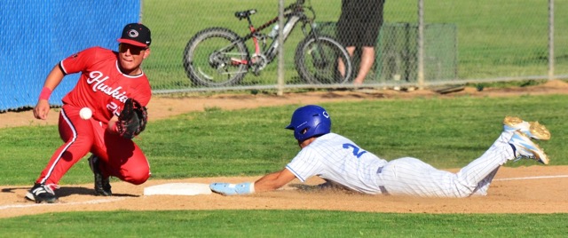 Centennial 3rd Baseman Bobby Anderson awaits the throw from catcher Michael Nonis as Norco’s Zion Martinez (24) slides safely into third.  The Cougars defeated the Huskies 8 – 4.