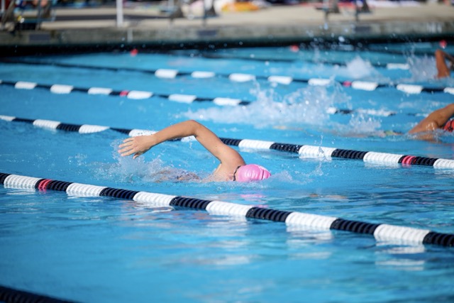 A Liberty High swimmer maintains a strong stroke and steady cadence during the freestyle event.