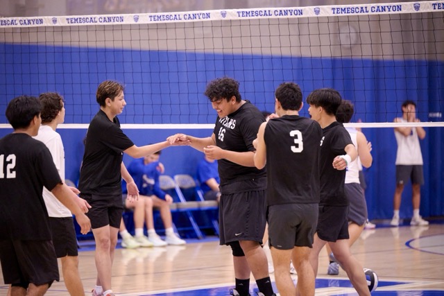 The Tahquitz Titans erupt in celebration after a hard-fought rally results in a point.