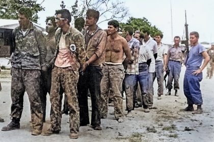 Colorized Photo. Members of the invading force, Brigade 2506, surrender to Cuban soldiers. They were tried, convicted, some executed, and imprisoned until December 1962 when an agreement was struck to return them to the United States in exchange for $53 million in food and medicine.  By Miguel Vinas - Warfare Blog