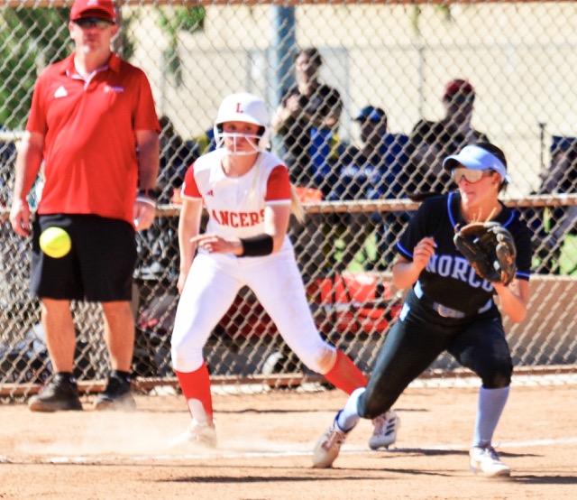 Norco third baseman Sadie Burroughs snares a line drive for the out in the Cougars 2 – 0 win over Orange Lutheran.