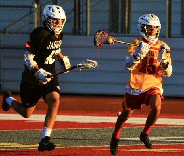 Segerstrom’s Pedro Romero (left) chases down Corona’s Riley Romero (right) during the Panthers 15 – 0 victory over the Jaguars.