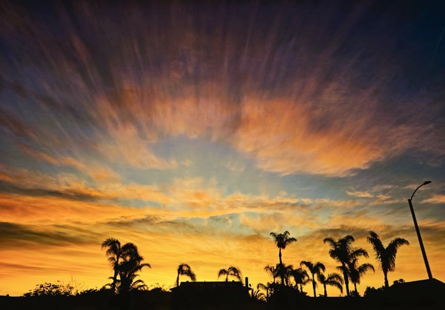 About to peek over the horizon, the rising sun casts its burning glow above the IE.
Credit: Photo by Gary Evans