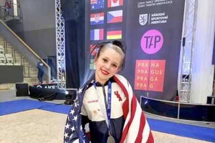MUSD 8th Grader. Harlie Granger beams with pride draped in American regalia. Credit: MUSD