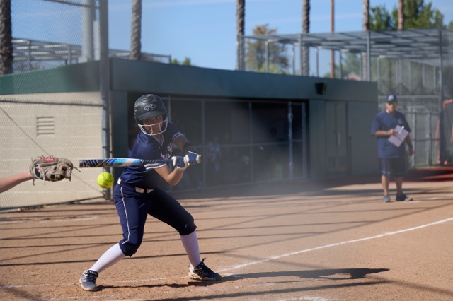 A Citrus Hill player showing good plate discipline eyes a called ball pass by her.
