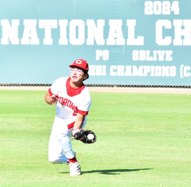 Corona’s Adrian Ruiz fights the sun in right field to catch a sinking line drive against Norco during the Panthers 6 – 4 victory in the first game of the league series.
