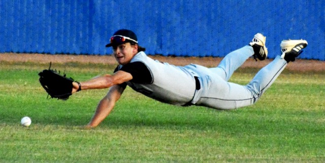 Santiago centerfielder Max Eldridge makes a diving try for a shallow line drive to center against Norco. The Cougars swept the three-game series from the Sharks.