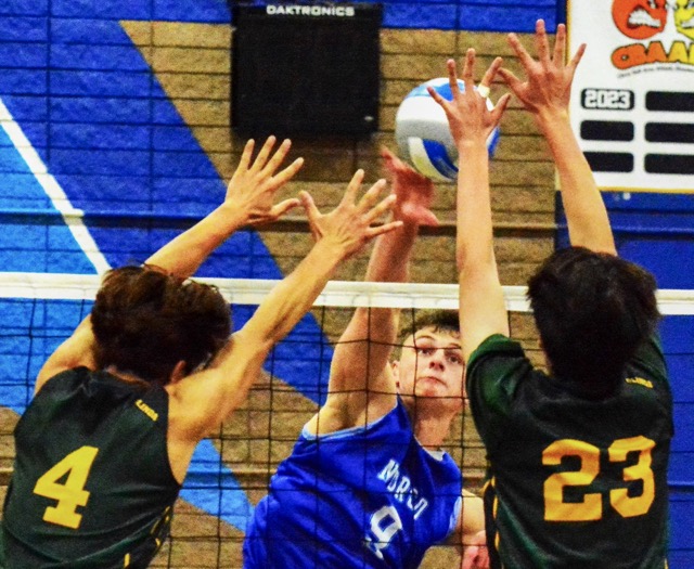 Norco’s Ryan Ibbetson (9) blasts a shot past Brea-Olinda’s Jeremiah Ammerman (4) and Jacob Sim (23) during the Wildcats 3 – 1 CIF second-round playoff victory over the Cougars.