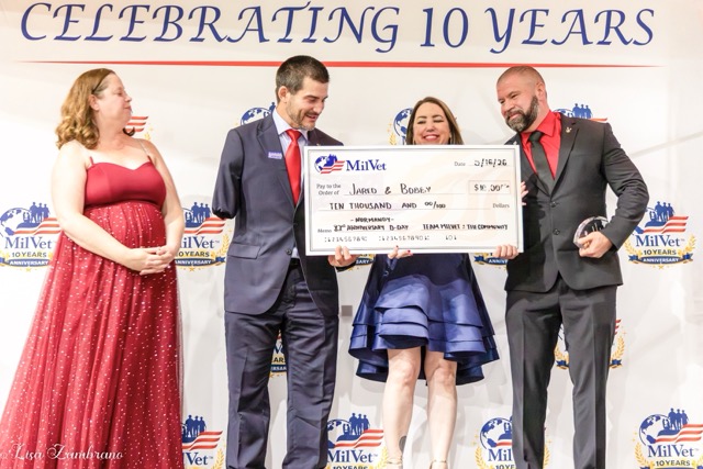 On behalf of MilVet, Raven Hilden (second from right), founder and CEO, presented Jared Lemon (second from left) and Bobby Carrasquillo (right) with the Heart of Honor and Service Award and a 5,000 dollar check, which will cover their jump in France for the 82nd Airborne on the 82nd anniversary of D-Day to honor fallen comrades. Credit: Photo by Lisa Zambrano
