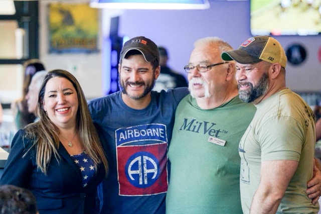 MilVet President Raven Hilden, left, stands with Purple Heart recipients Jared Lemon, second from left, and Bobby Carrasquillo Jr., right, along with MilVet volunteer Lee Cooper, second from right at an event to raise $10,000 for them to parachute at the 82nd anniversary of the Battle of Normandy, also known as D-Day. The event was co-hosted with VAREP Temecula Valley Chapter and held at The Cove Bar and Grill in Murrieta.