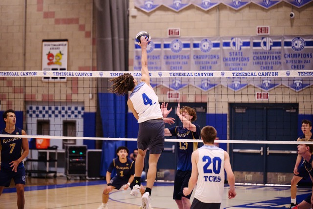 Temescal Canyon’s Ryan Patterson (#4) climbs the ladder for a clinical kill during the second set. Despite a diving effort from the Rangers' back row, Patterson’s precision helped keep the Titans in control of the momentum.