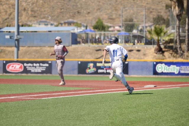 Titans #11 Tyler McClaren starts to round first after a hit
