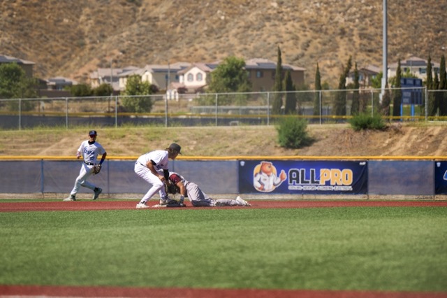 Riverside Prep #8 Trent Bourgeios beats the thrown and slides into second base on a hit