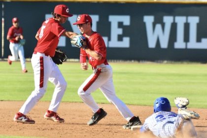 While left fielder Bryce Kim runs in (left), Corona shortstop Dylan Salcedo (center) flipped the ball to second baseman Ryan Pantoja for the inning-ending force of San Diego Eastlake’s Jordan Gomez (sliding) during State Regional playoff action. The Panthers defeated the Titans 4 – 1, but then lost to Huntington Beach 11 – 3 the next day.