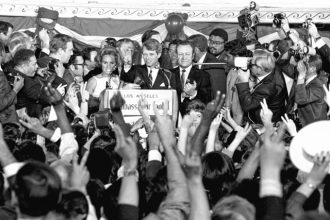 This picture of Sen. Robert F. Kennedy talking to campaign workers in Los Angeles was made minutes before he was shot early today, June 5, 1968. At his side are his wife, Ethel, and his California campaign manager, Jesse Unruh, speaker of the California Assembly. After making a short speech, Kennedy left the platform and was shot in an adjacent room.  Credit: AP Photo/Dick Strobel