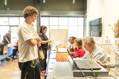 Ryder Lawrence, 18, a first time voter, picks up a ballot for the CA primary election, June 2nd, 2026. Credit: Lisa Zambrano
