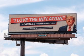 US Inflation. An electronic billboard with an image of President Donald Trump reads "I love the inflation." - Donald J. Trump June 10, 2026," is seen near I-74 in Cincinnati, Tuesday, June 16, 2026.  Credit: AP Photo/Carolyn Kaste