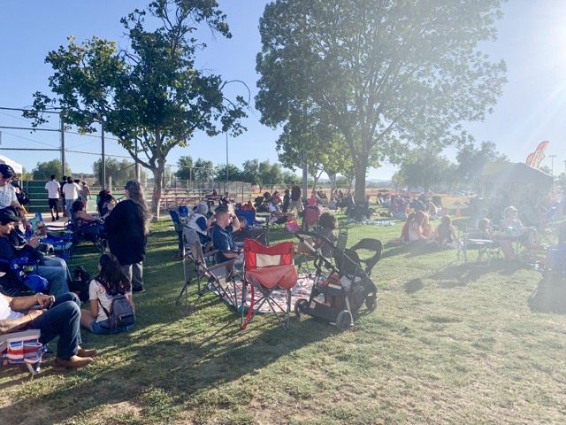 Hundreds attended and set up easy ups, chairs, and blankets to watch the performers and secure a good spot to watch the fireworks at 9 p.m.. Photo by Mia Rotell
