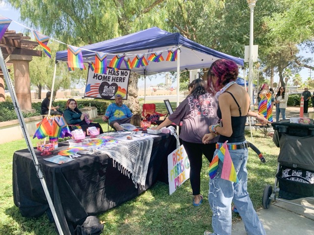 Booths were spread across the library’s courtyard with different awareness pamphlets, flags, hand-held fans, and other objects to show support. Photo by Mia Rotell