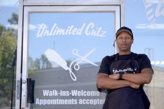 Barber Buzz, Unlimited Cutz. Tunk Stillwell, owner of Unlimited Cutz, has built a community with his barber shop. Credit: Marcus Walker