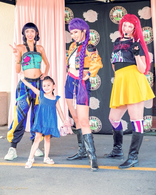 A Huntrix (K-Pop Demon Hunters) tribute group performed and took pictures with guests at Perris Con