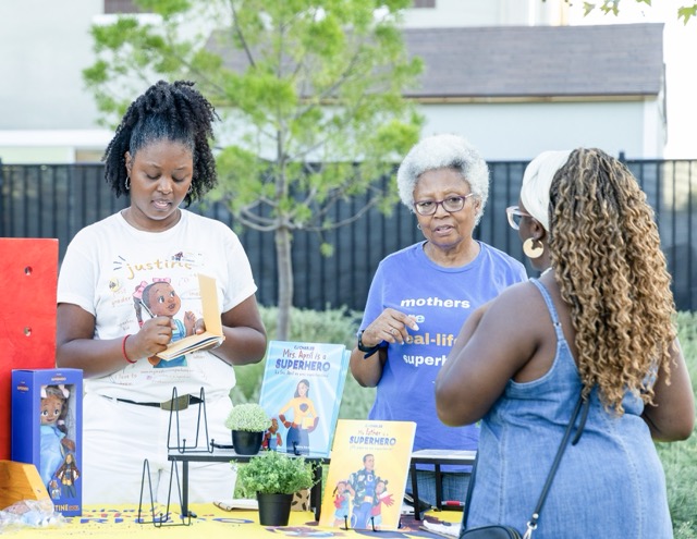 Author, C.J. Charles, left, and her mother, held a reading and signing of C.J.’s book, “My Mother is a Superhero,” sponsored by Jah Jah’s Juice Garden in Menifee, August 22.