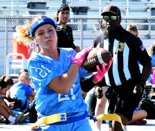 Norco’s Ellie Flood (21) catches a touchdown pass from quarterback Jamie Martinez during the Cougars 41 – 0 thrashing of the Lakeside Lancers. 