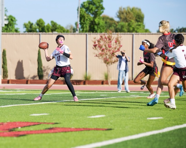 Paloma Valley’s #17 Mandi Ball looks downfield for a receiver as Murrieta Valley defenders apply pressure
