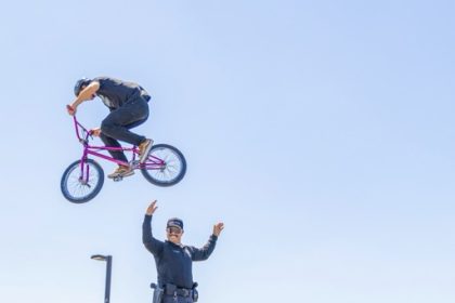 A BMX rider Jumps over Officer Torres from the Val Verde District Police Department Credit: Lisa Zambrano